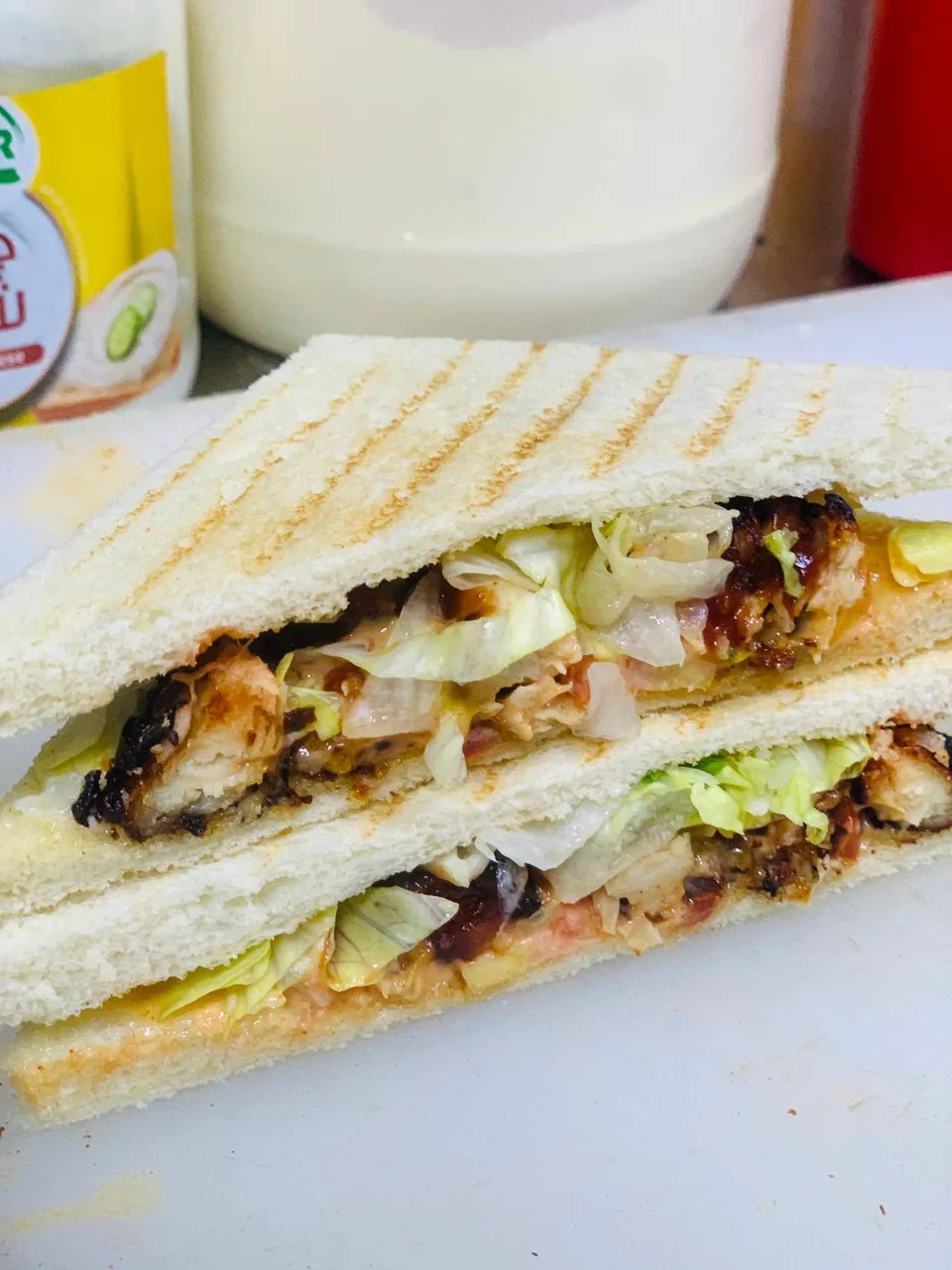 Pressed club sandwich with chicken and lettuce
