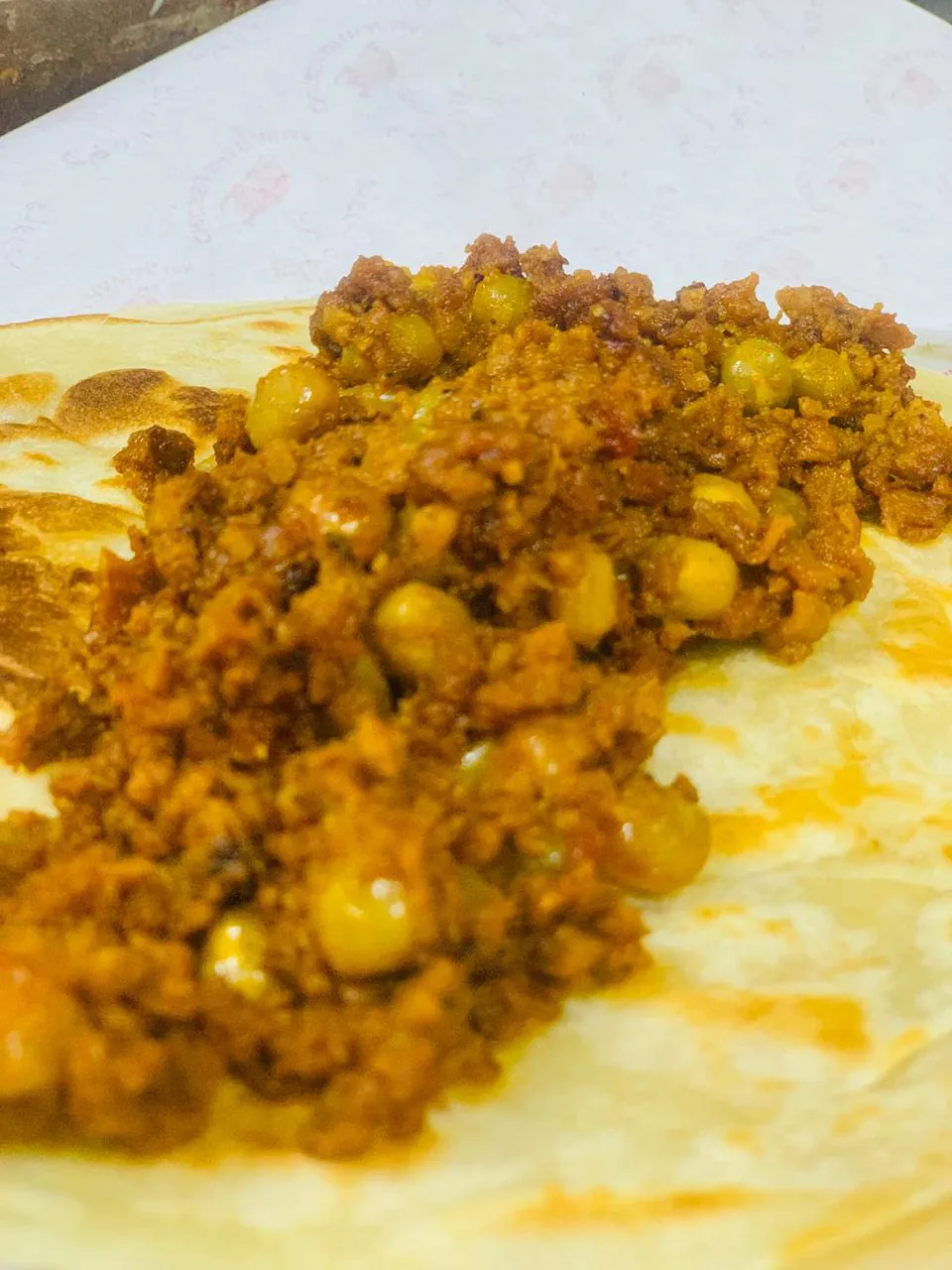 Spiced minced meat and chickpeas served on chapati
